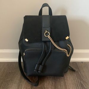 Black backpack with gold accents
